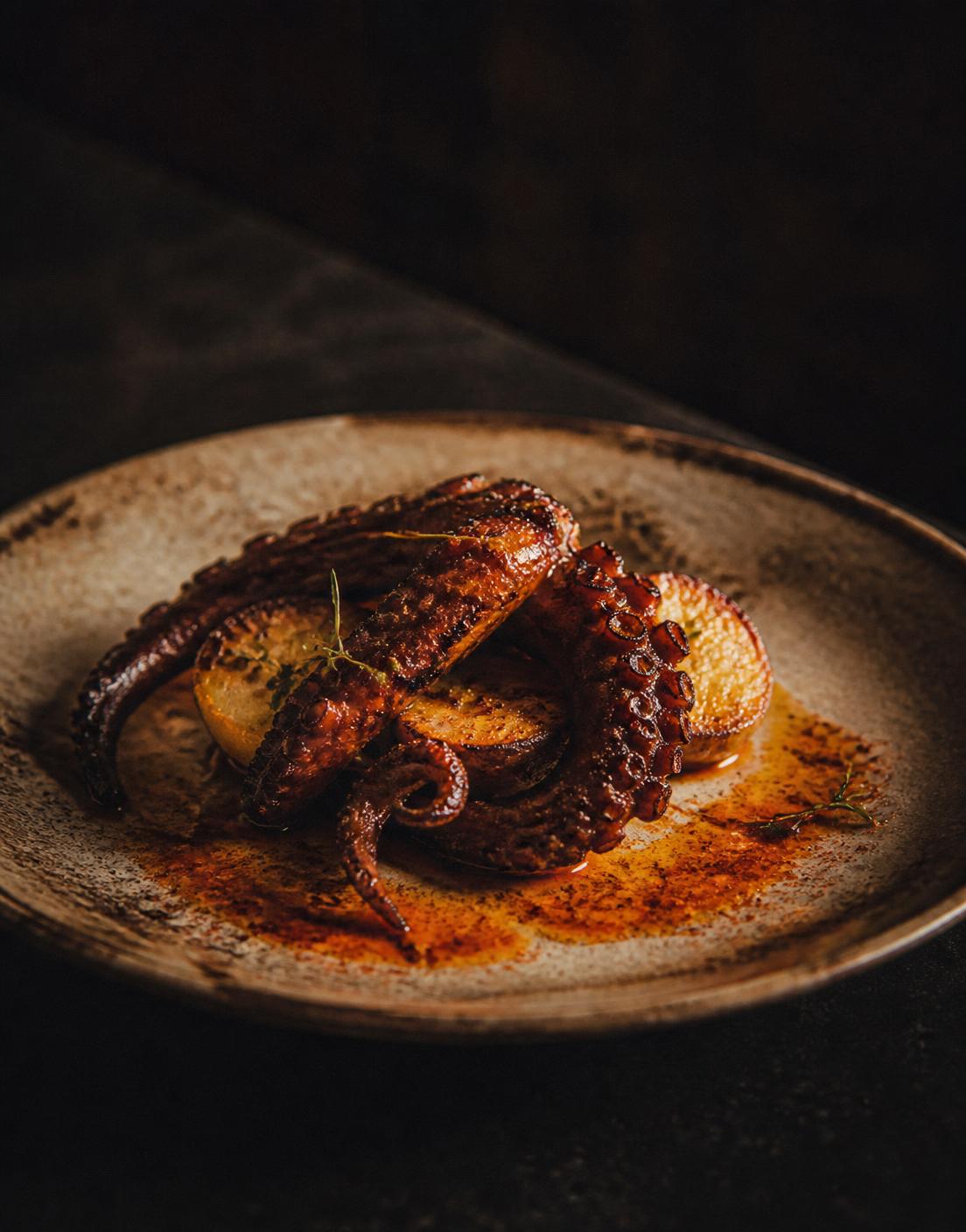 Charred octopus with smoked potato and paprika oil